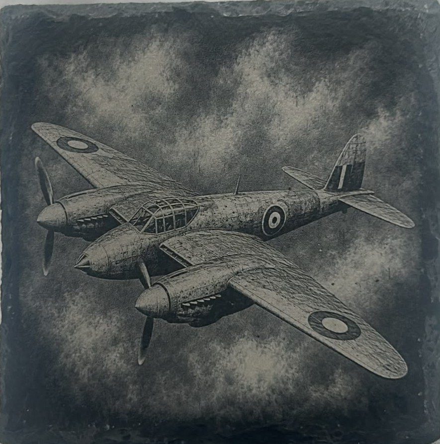 Vintage aircraft in flight engraved on slate